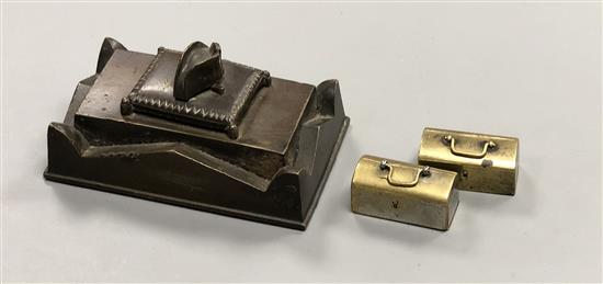 A bronze Napoleon paperweight and two domino cases
